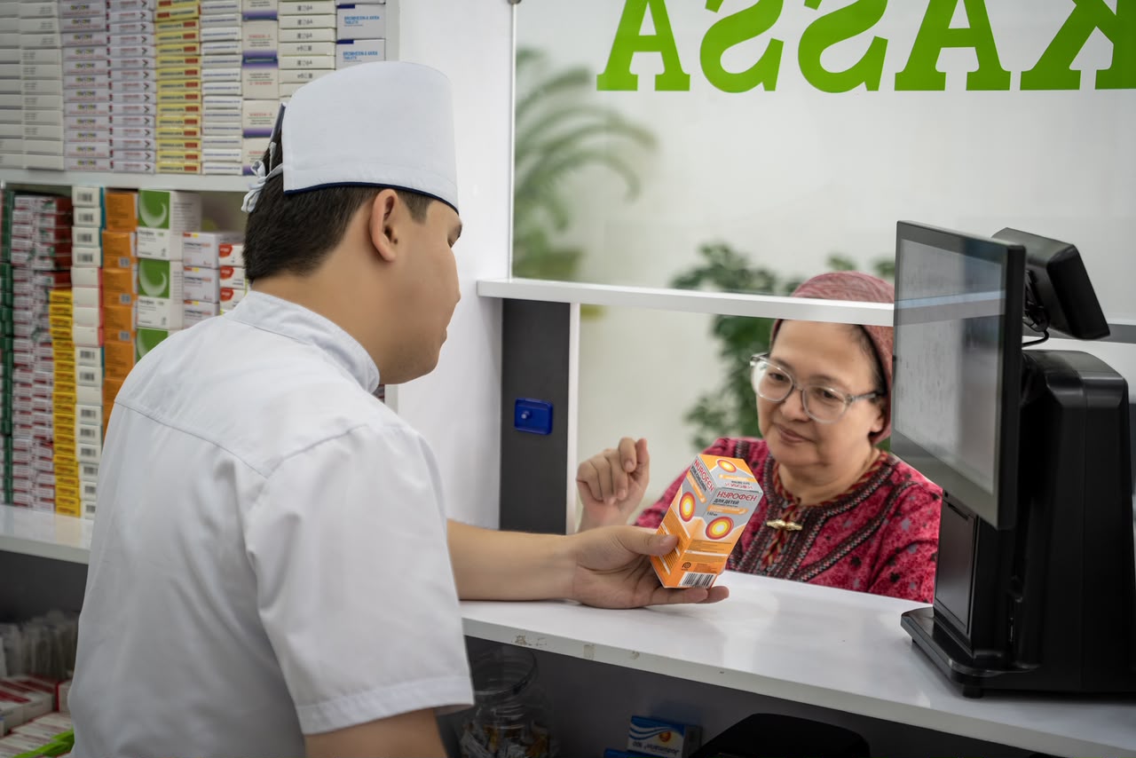 Medkent pharmacy — serving a customer